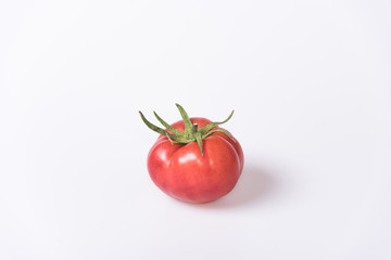 red single tomato on white background