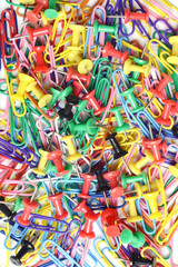 Fototapeta na wymiar background of push pins and paper clips