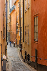 Fototapeta na wymiar Stockholm medieval narrow cobblestone street in a old city center on island gamla stan. Sweden