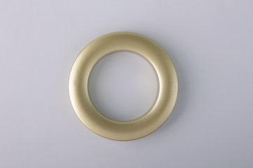 Plastic rings for fastening the fabric to the cornice for curtains. Multicolored plastic eyelets for curtains. Square, rectangular, triangular, round eyelets for curtains. © SOLOTU