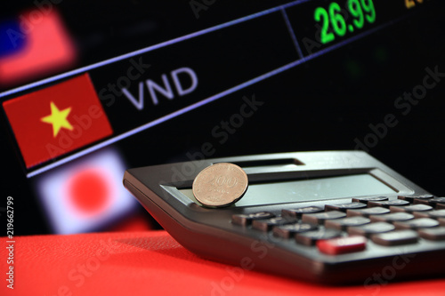 Two Hundred Vietnam Dong Coin On Reverse Vnd Black Calculator Two Hundred Vietnam Dong Coin On Reverse Vnd Black Calculator And Red Floor
