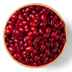A bowl of a ripe dogwood on white. Top view