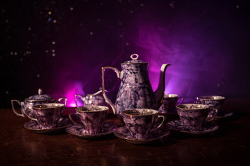 Food background tea and coffee theme. Old vintage ceramic tea or coffee pot with cups jug and sugar...