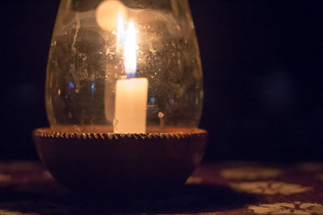 Candle in a Pot Under the Glass