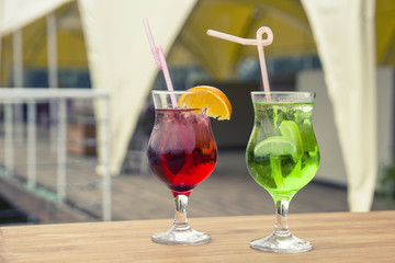Coloured coctails are on the tablte, close up