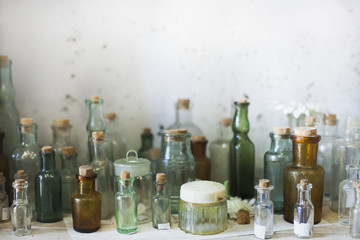 different glass bottles and jars on the shelf