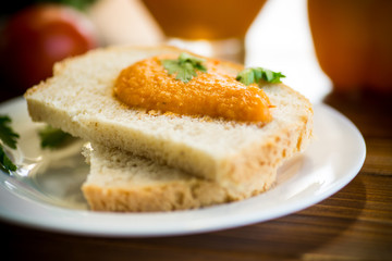Fototapeta na wymiar Homemade caviar of vegetables on a slice of bread