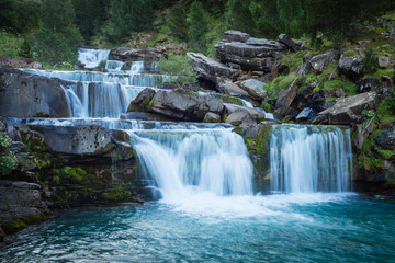 Fototapeta na wymiar Waterfalls in Ordesa and monte perdido national park in Pyrinees range in Spain, Huesca, gradas Soaso