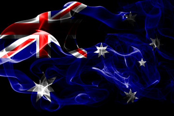 National flag of Australia made from colored smoke isolated on black background. Abstract silky wave background.