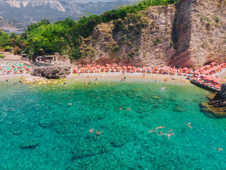 Fototapeta premium aerial view. people resting at seaside. sunbathing at sun loungers