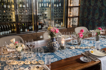 Wine bar tasting set up decoration. Many wine glasses and bottles