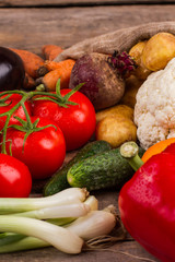 Healthy eating. Clean fresh vegetables on wooden table, close up.