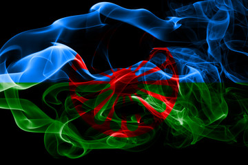 National flag of Gipsy made from colored smoke isolated on black background. Abstract silky wave background.