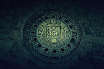 Steel pipe cap on the floor at the Street of Cesky Krumlov, Czech Republic.