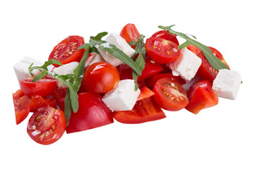 fresh salad of sweet pepper, cherry tomatoes and feta cheese, decorated with greens, on white background, isolate