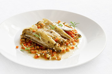 steamed in white wine with fired  vegetables and herbs marinated saffron cod fillets