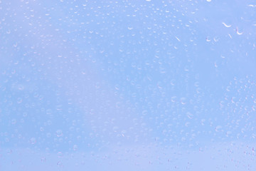 Waterdrops on blue clear background. Water background