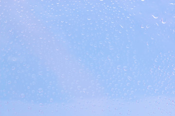 Waterdrops on blue clear background. Water background