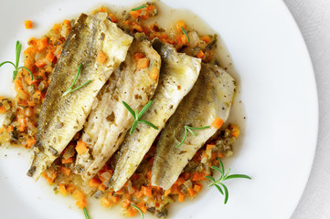 wine steamed marinated saffron cod fillets on vegetables and herbs