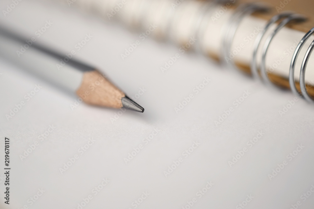 Poster macro shot of sharpened pencil on white paper