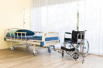 Hospital room with empty bed,infusion set , intravenous fluid and wheelchairs to creative for design and decoration on background.Copy space.