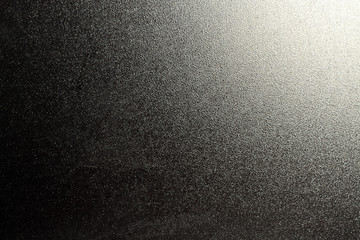 Obraz premium Szlifowana tekstura szkła z oświetleniem w rogu