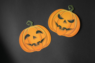 Paper orange halloween pumpkins with black backgorund