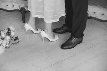Black and white image of loving couple of man and woman during their wedding day. Horizontal color photography.