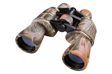 new binoculars for traveling or hunting, camouflaged under foliage and grass, on white background, isolate