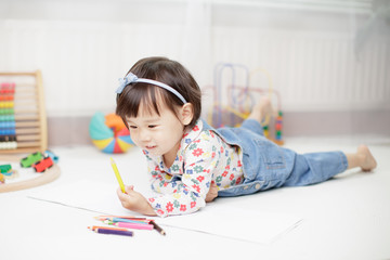 baby girl learning draw at home