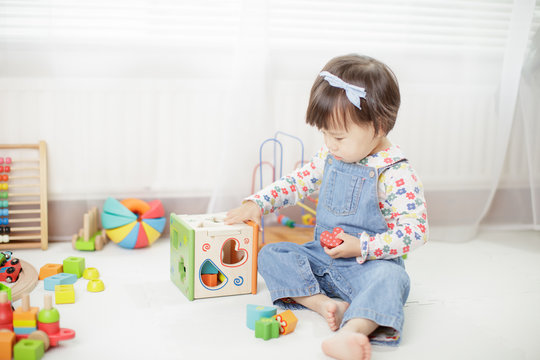 Baby Girl Play Toy Blocks At Home