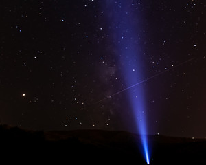 Flying meteorites in the night starry sky against the mountains, astrophotography. © PORTFOLIO studio