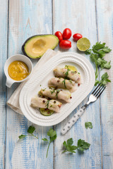 swordfish rolled up stuffed with avocado and mustard