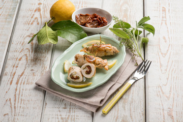 turkey rolled up with dried tomato sage and oregano