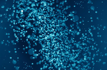 abstract blue bokeh glitter sparkle background.