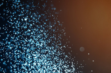 abstract blue bokeh glitter sparkle background.