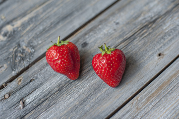 Beautiful juicy berries of strawberry on a wooden background