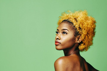 Portrait of teen girl with dyed afro hairstyle