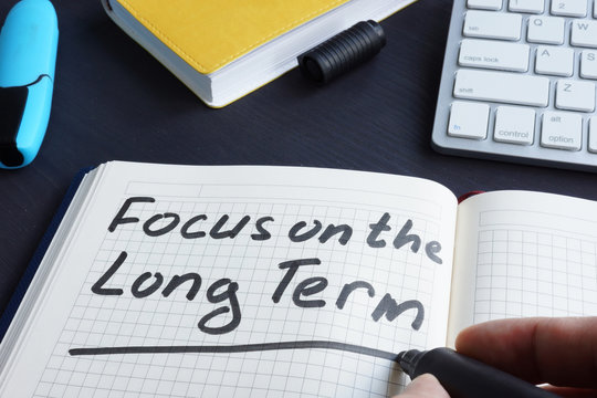 Man Is Writing Focus On The Long Term.