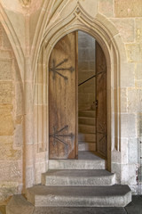 Fototapeta na wymiar Old, wooden door with stone stairs.