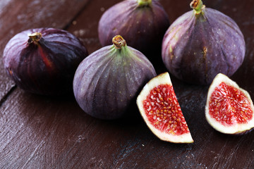 Fresh figs. Food Photo. whole and sliced figs on rustic background.