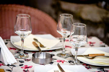 Tables in a cafe on the street of the ancient city 
