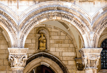 Obraz premium Bas-relief on an ancient Catholic Church in Dubrovnik,Croatia. 