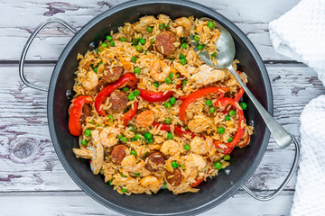 Spanish paella with prawns, chicken, chorizo and red pepper - top view