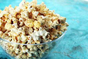 Cinema concept with popcorn on rustic table