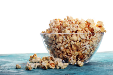 Cinema concept with popcorn on rustic table