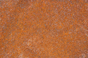 Rusty metal surface background orange colored empty space