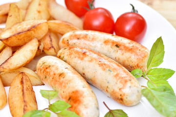 Bavarian sausages. German cuisine. A dish of chicken meat.