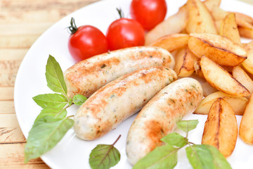 Bavarian sausages. German cuisine. A dish of chicken meat.