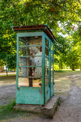 An abandoned phone booth in the cobbled streets of Suomenlinna in Finland
